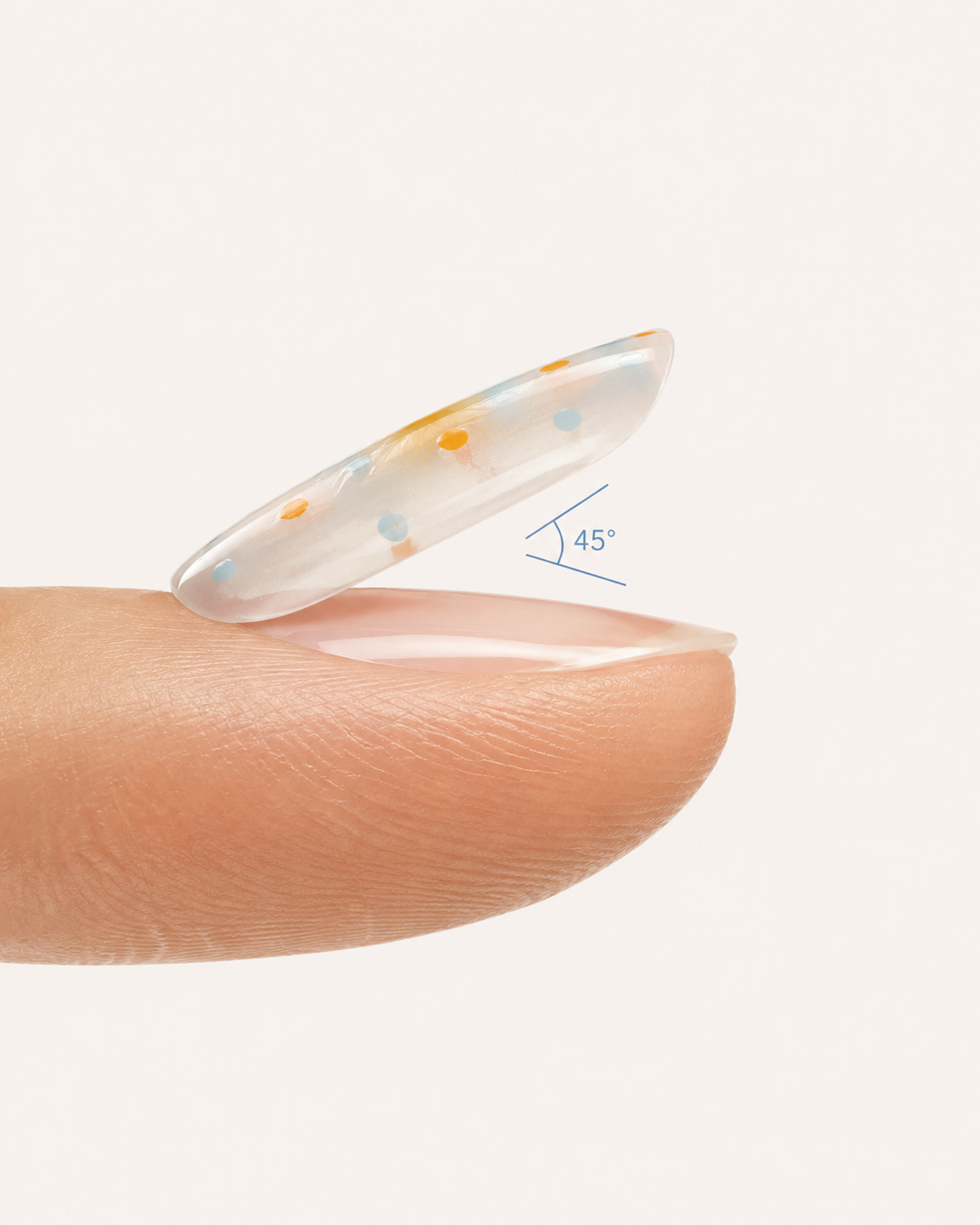 Press-on nail positioned near the cuticle at a 45 degree angle