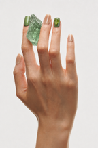 Hand wearing With Grace peach and green press-on nails with color blocks and crystal fragments